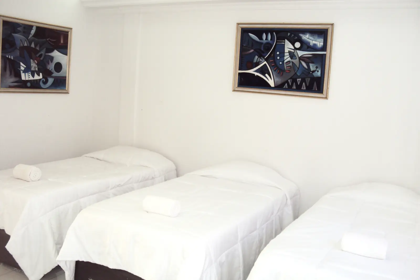 Habitación triple con tres camas